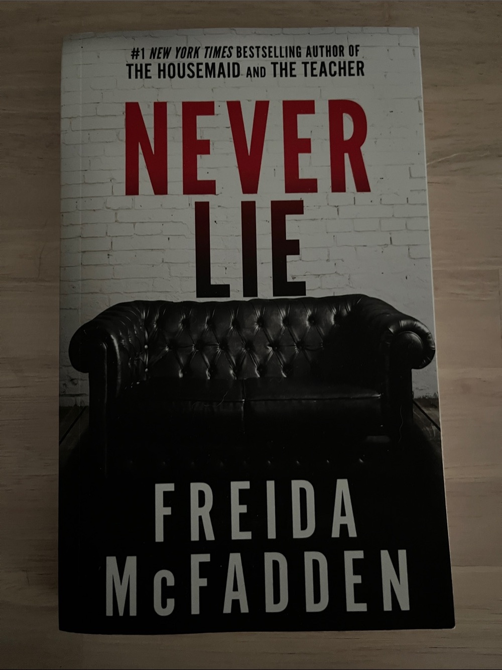 Never Lie by Freida McFadden - Bold Red & Black Cover